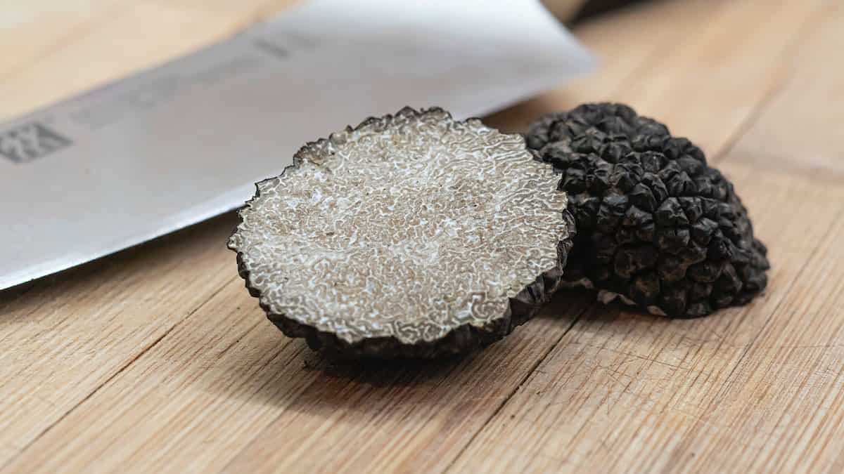 black and gray round ornament on brown wooden table