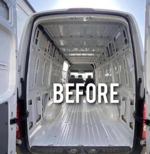 The inside of a gutted van before the van conversion. 