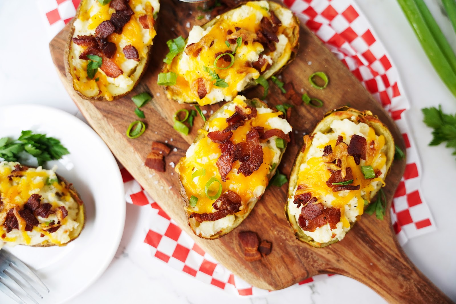 Twice baked potatoes on a serving platter.