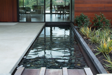 top water features to install for your outdoor living space reflective pool in front yard custom built michigan