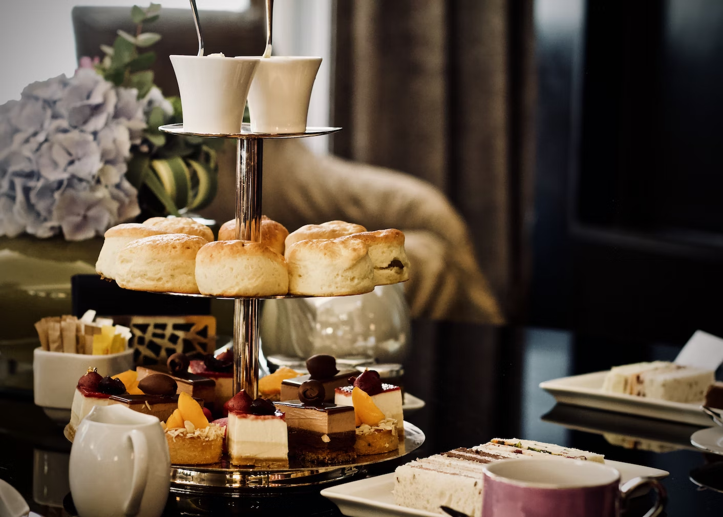 Afternoon tea party tiered stand with scones and sweets