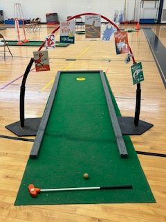 image of a mini golf lane set up in the gym