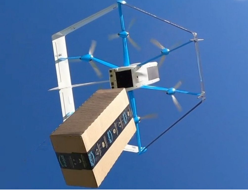A drone carrying a box

Description automatically generated