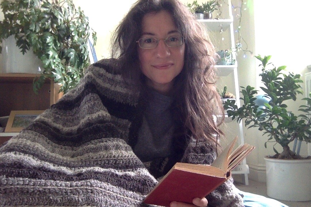 Enjoying an old classic in the lovely cocoon of my handmade throw—gift to self!