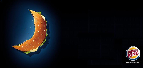 The image shows how Burger King has adapted to the Muslim culture and created its advertisement in Ramadan style by showing a mostly eaten burger, presented in the shape of a crescent moon.  Source - islamicity