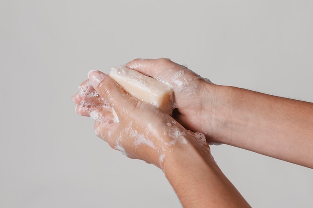 Hygiene concept washing hands with block of soap