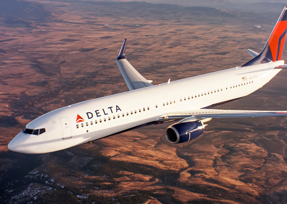 Delta aeroplane is shown in the picture flying over a barren land. 