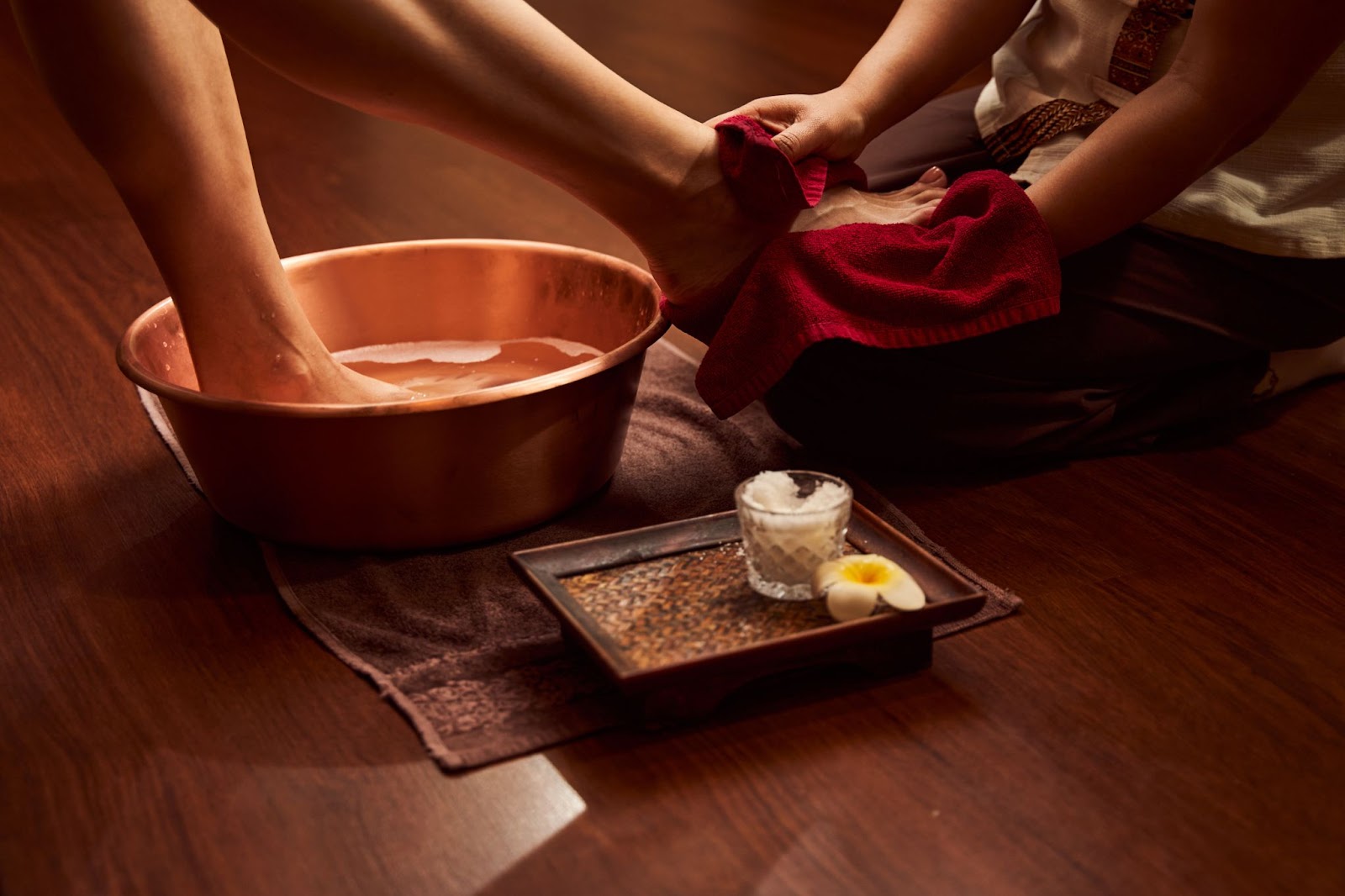 A soothing foot soak as part of a relaxing massage and spa treatment, highlighting the significance of massage and spa in today's world.