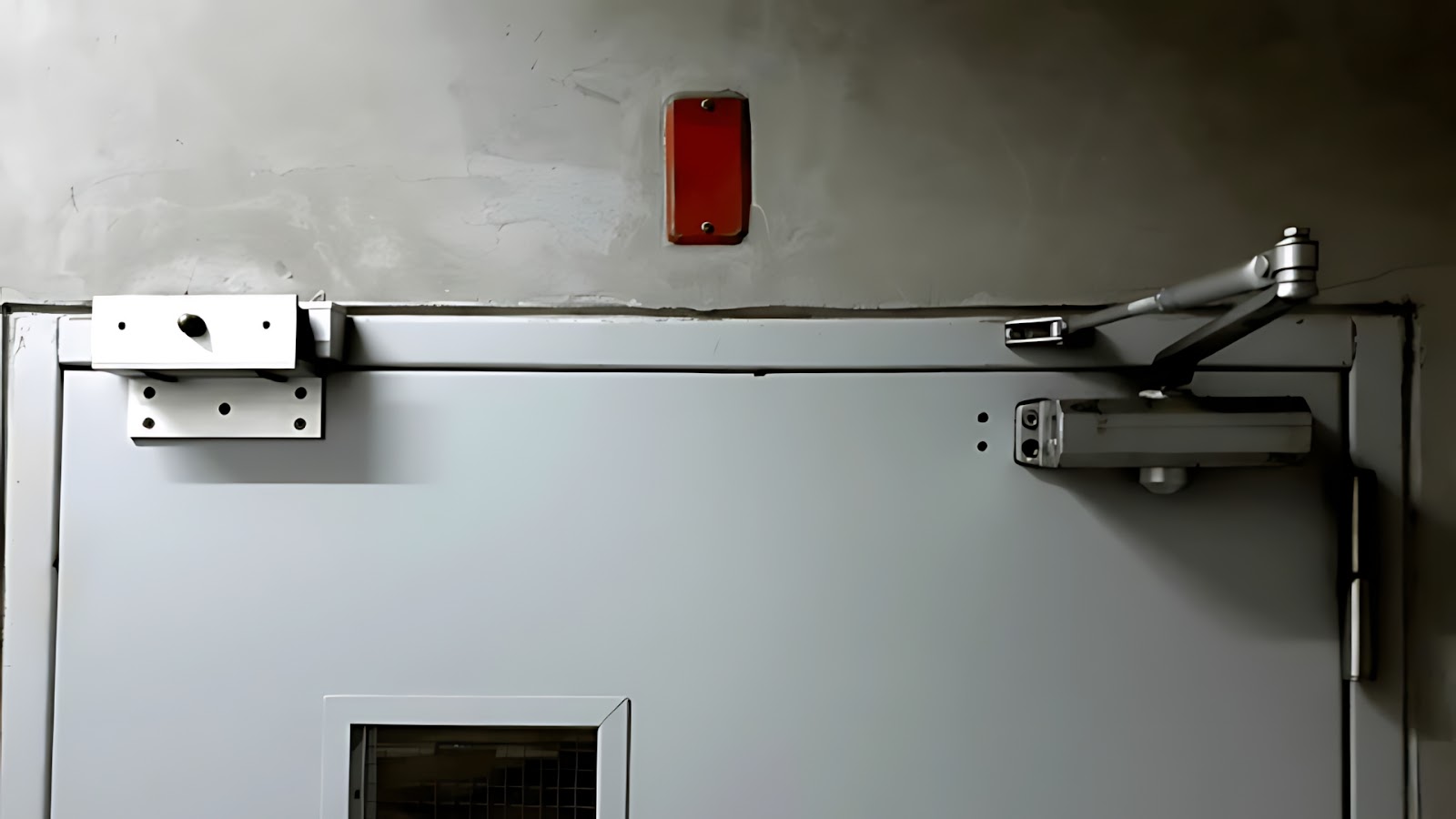 An exit door equipped with magnetic locks and a door closer 