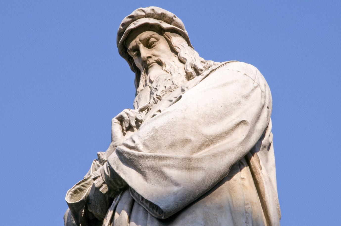 A statue of a person with a beard

Description automatically generated