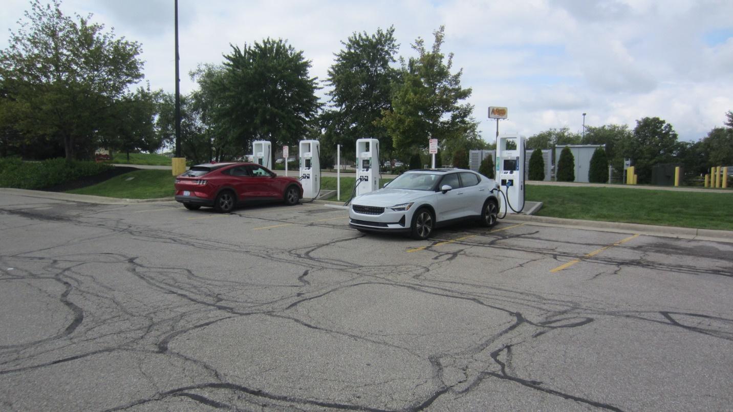 A car charging station with a white car

Description automatically generated with medium confidence