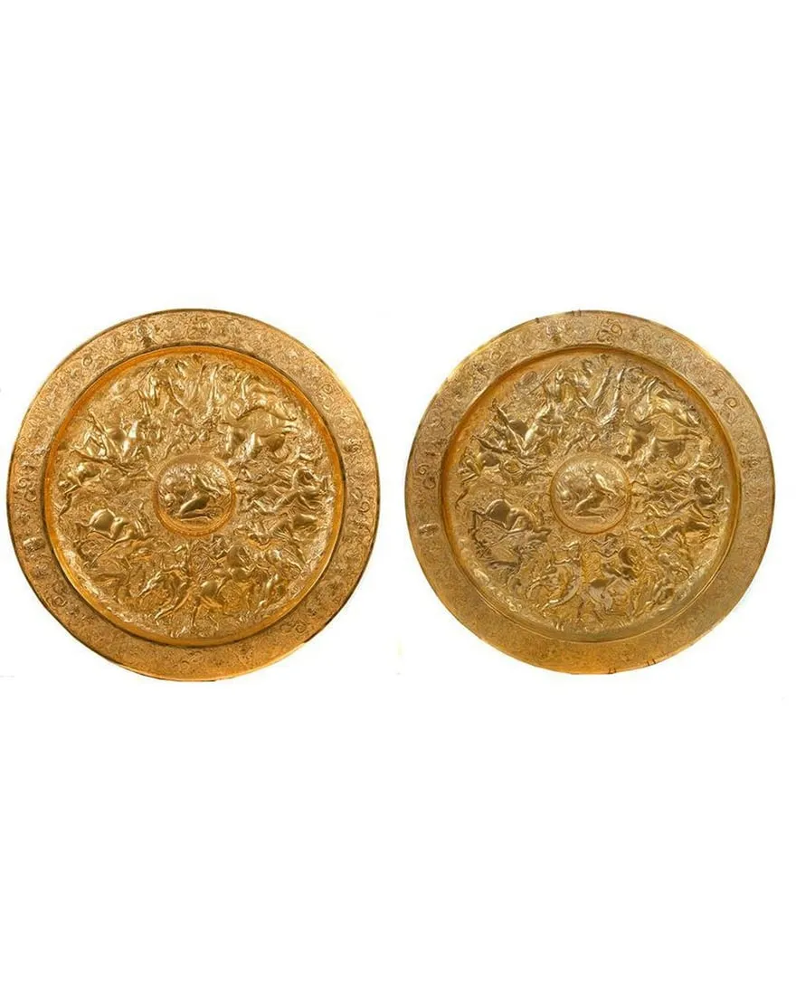 A pair of gold circular objects

Description automatically generated