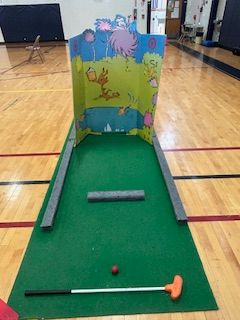 image of a mini golf lane set up in the gym