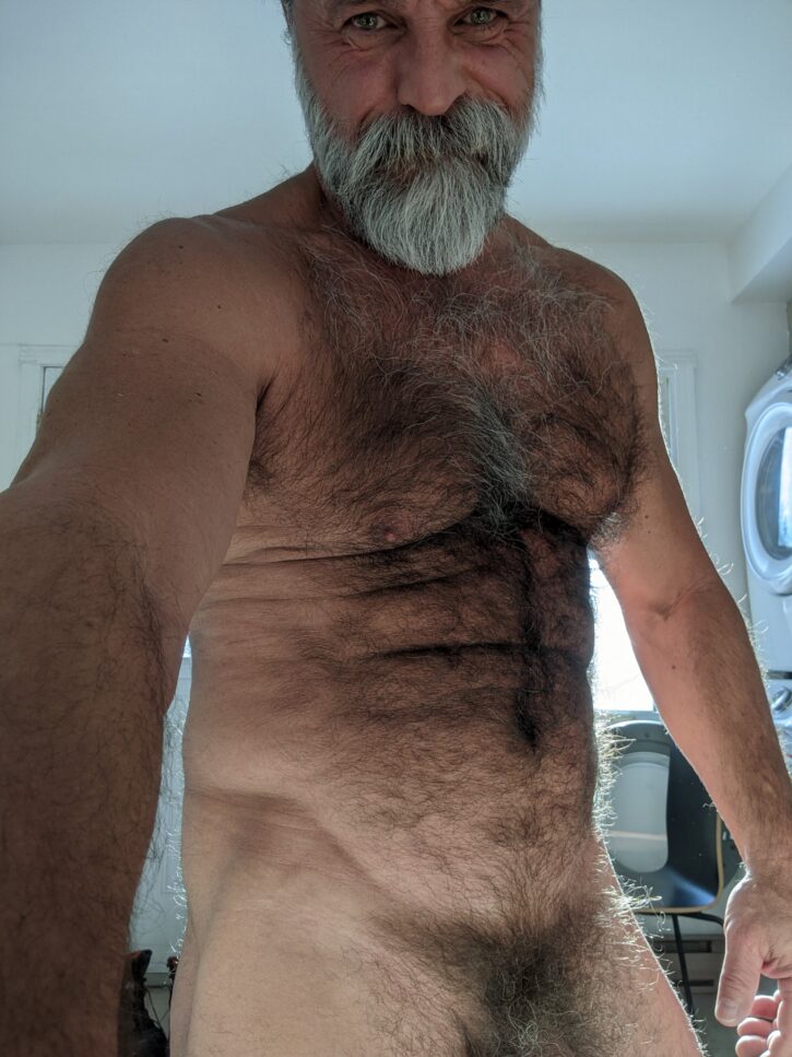 Daddy John taking a naked selfie in his apartment with an iphone selfie camera
