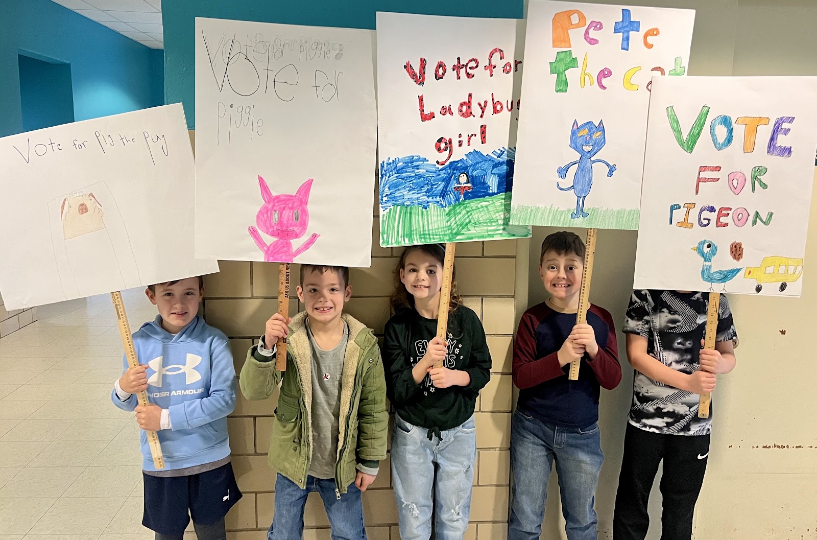 image of students holding voting signs