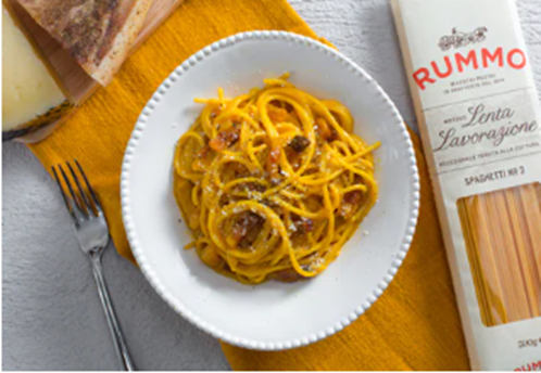 Spaghetti Carbonara: A Roman dish made with eggs, Pecorino Romano cheese, guanciale (pork cheek), and black pepper.