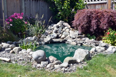 top water features to install for your outdoor living space pond with stones custom built michigan