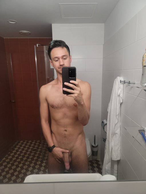 Dakota Wonders naked taking a selfie in the bathroom holding his flaccid cock in his hand