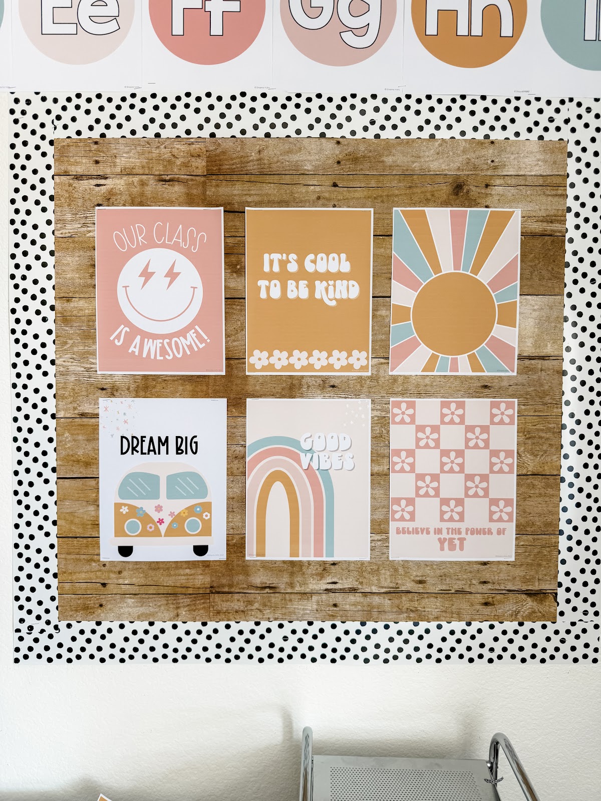 This image shows a bulletin board with six pastel retro classroom theme inspirational posters displayed. The posters read things like "Our class is awesome!" and "Good Vibes". 