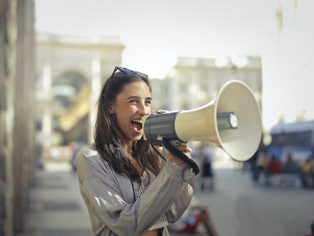 A person yelling into a megaphone