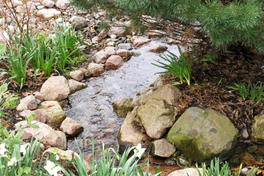 top water features to install for your outdoor living space yard stream custom built michigan