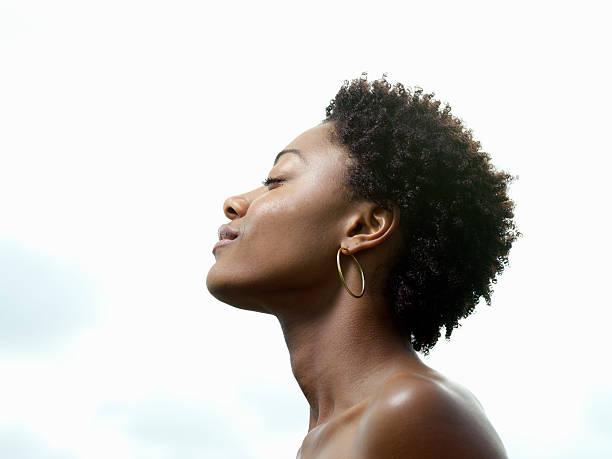 young woman, eyes closed, low angle view, profile - black woman stock pictures, royalty-free photos & images