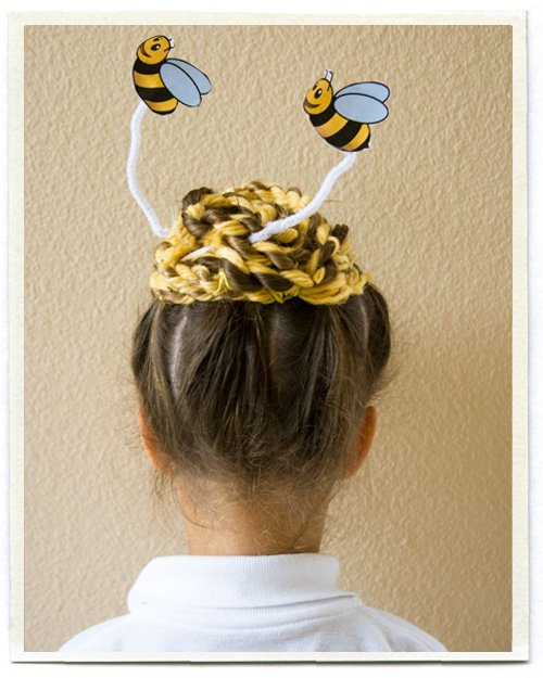 Picture of a young girl rocking a Bee hive design for the event