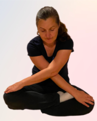 A person sitting cross legged with crossed legs    Description automatically generated