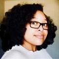 A person with curly hair

Description automatically generated with medium confidence