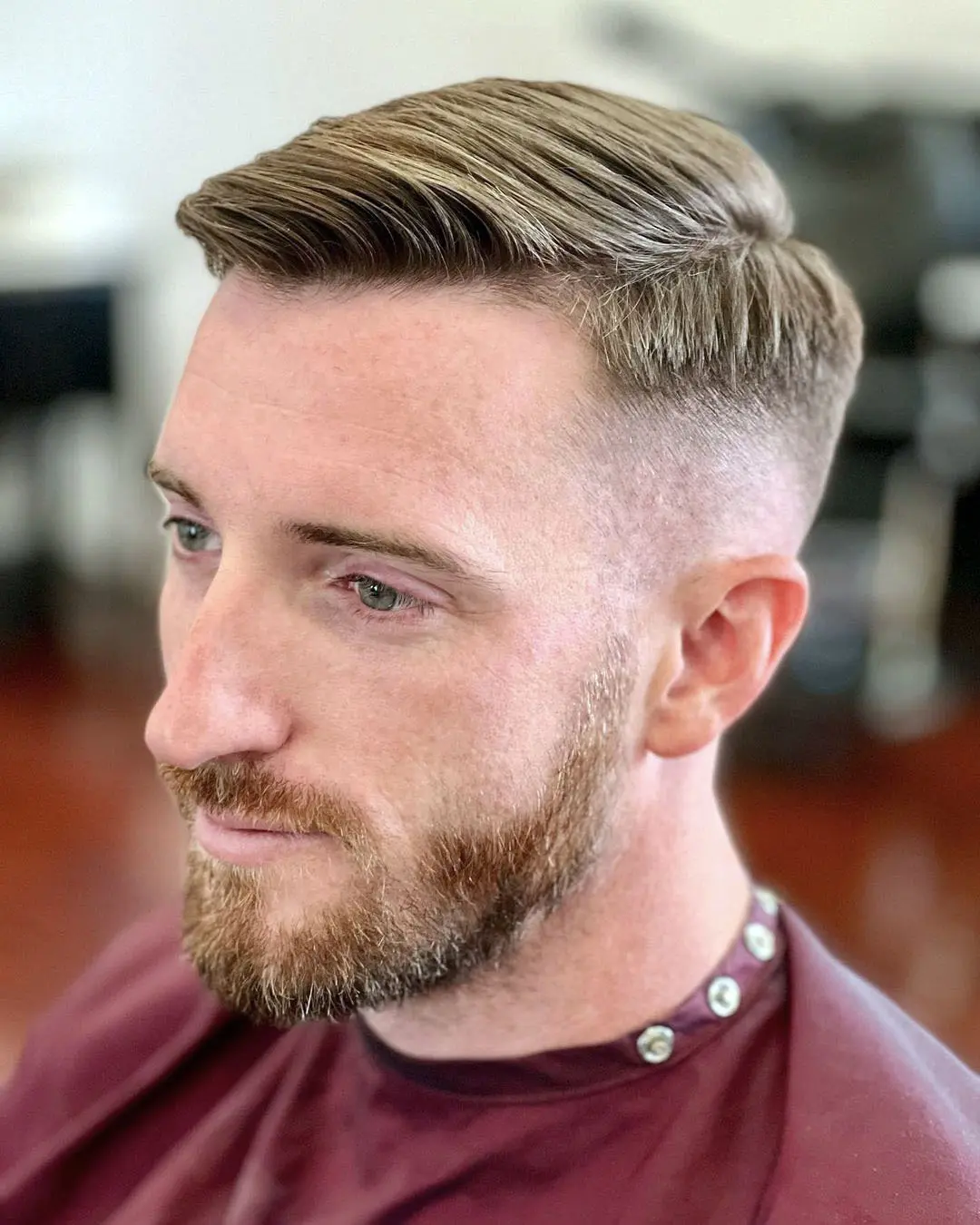 Full picture shows a man rocking the side part