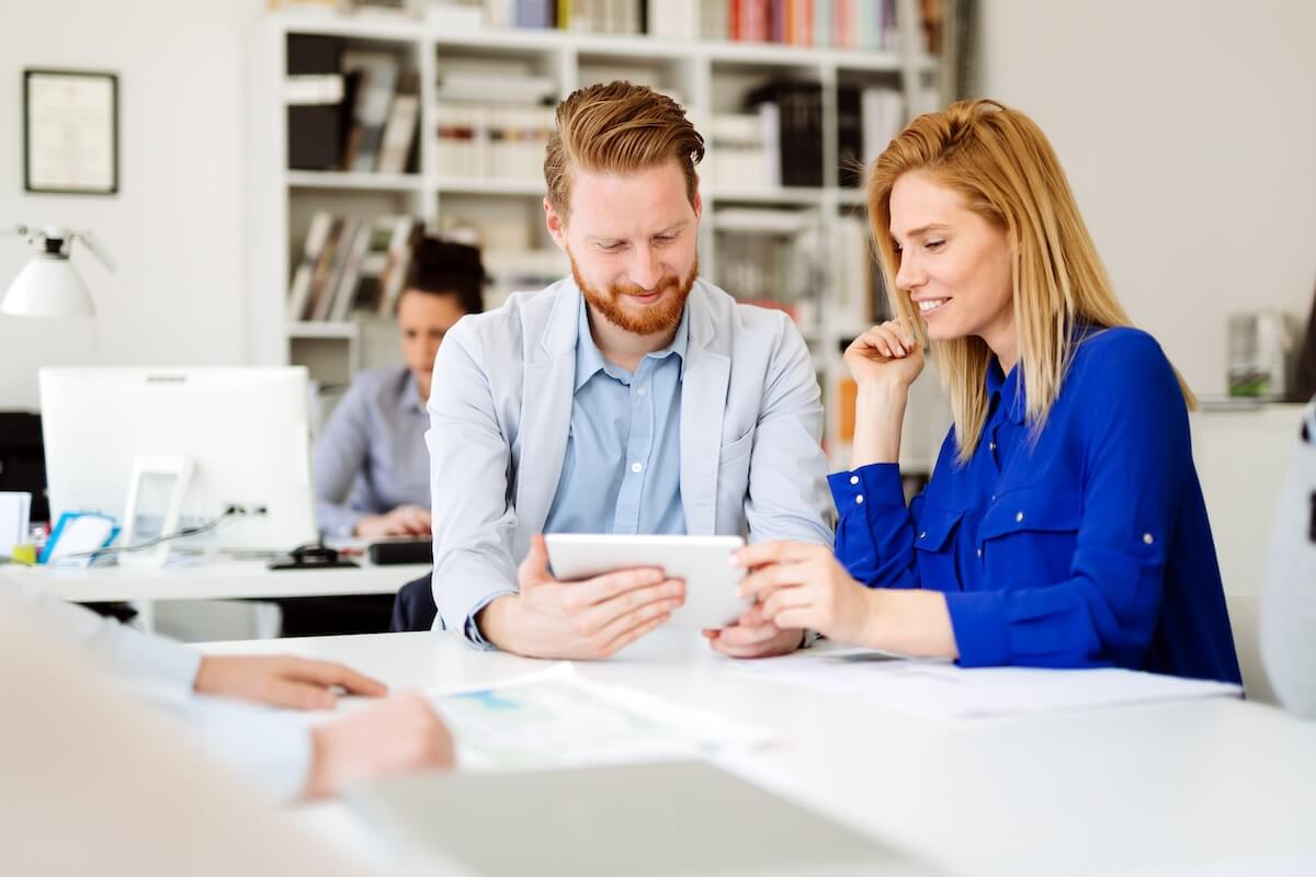 Entrepreneurs looking at a tablet