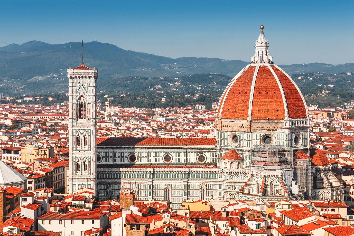 A large building with a dome and Florence Cathedral

Description automatically generated
