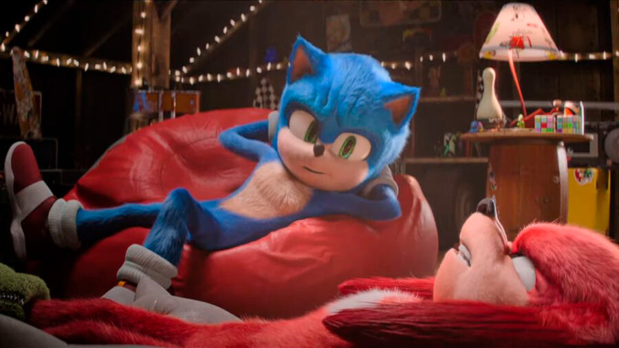 Sonic en su habitación, acostado en un puff. Está hablando con Knuckles, que está recostado en el suelo con cara de furioso como siempre.