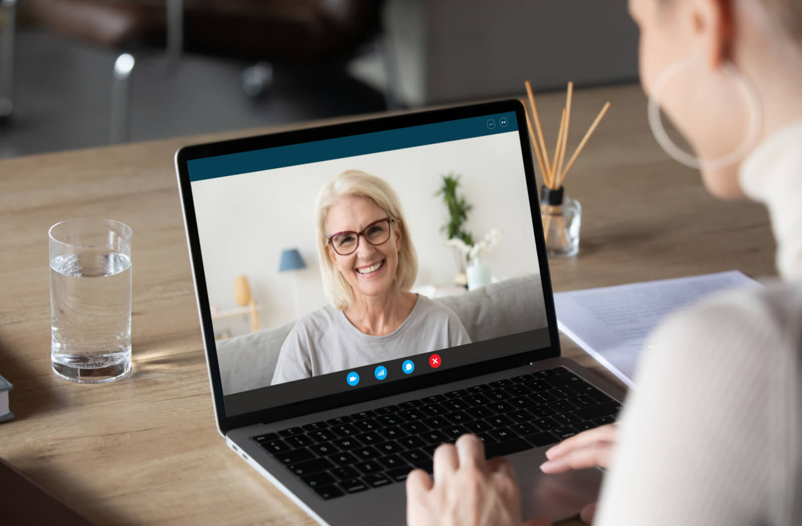 woman chatting with her mother over the computer.