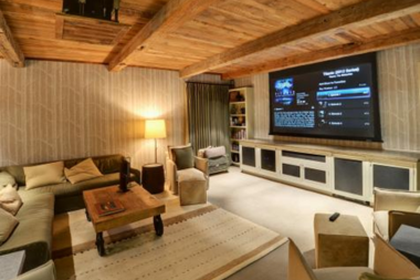 ways to prepare your basement space for hosting home theater with screen and couch custom built michigan