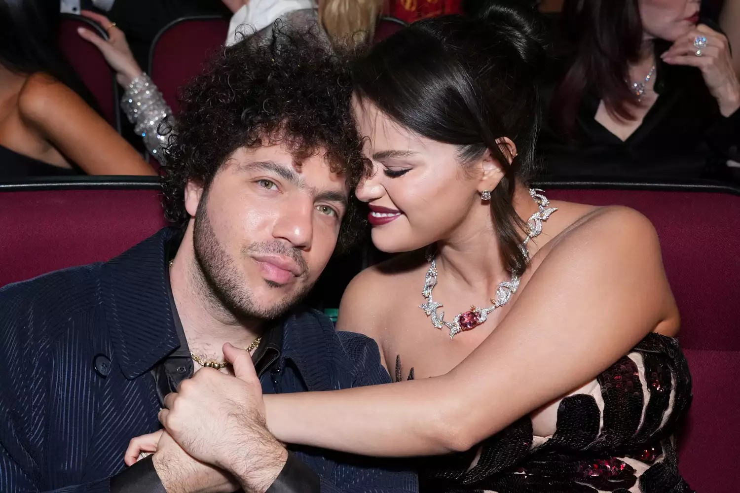 The couple posed together, smiling for the camera, showcasing their love on...