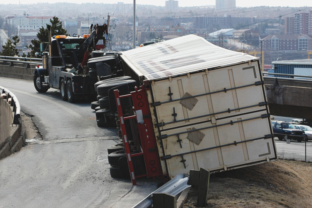 Overturned semi truck due to substance abuse on the road, failed alcohol test