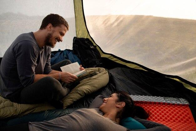 High angle adventurous couple bivouacking
