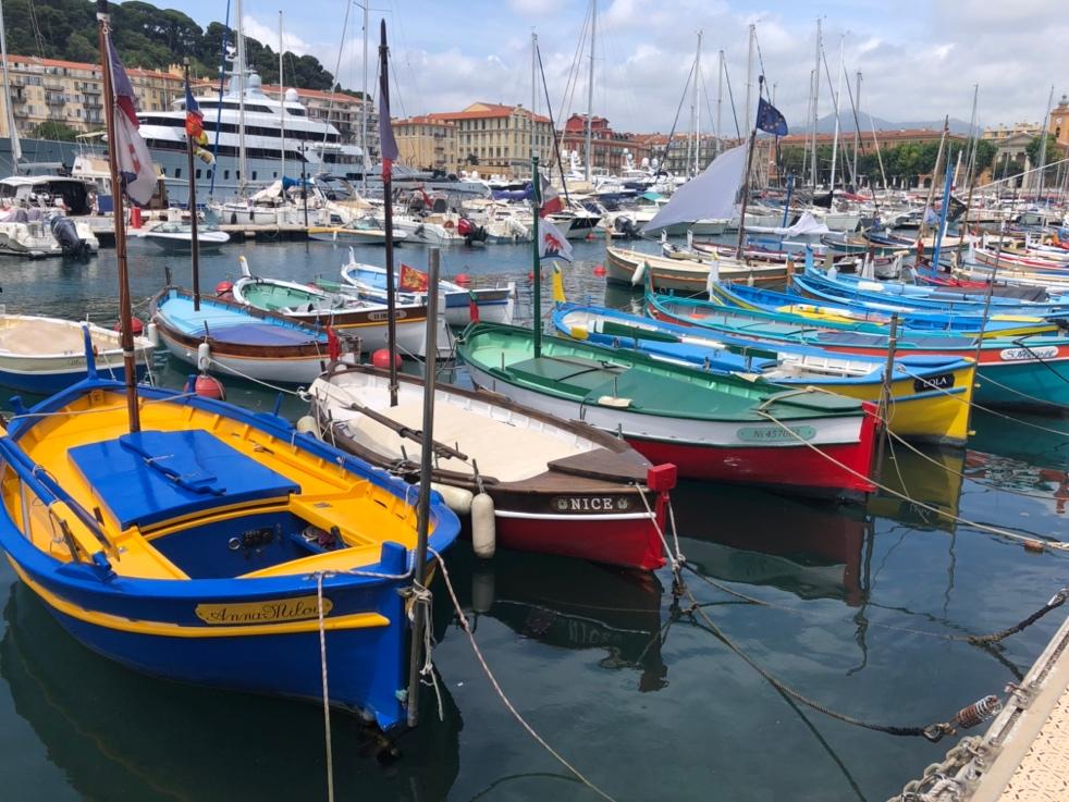 A group of boats in a harbor

Description automatically generated