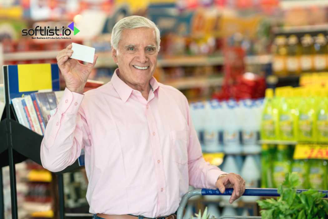 Elderly man holding a white card in a grocery store