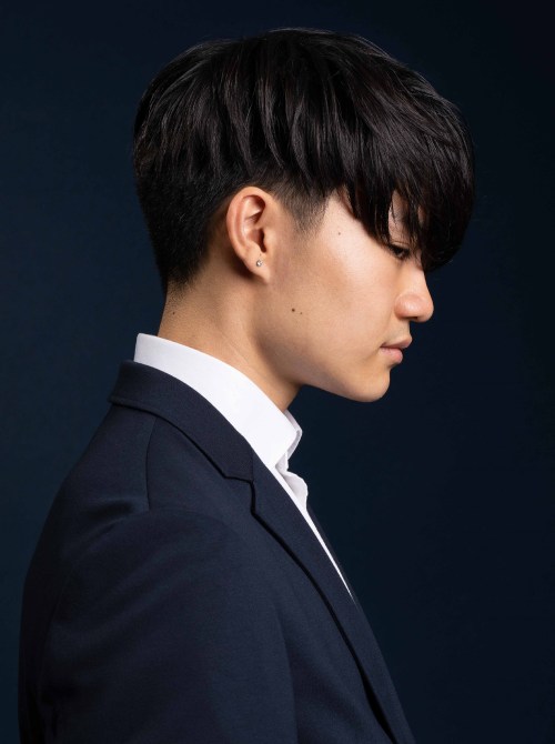 Side view of a guy wearing the Two Block Bowl Cut