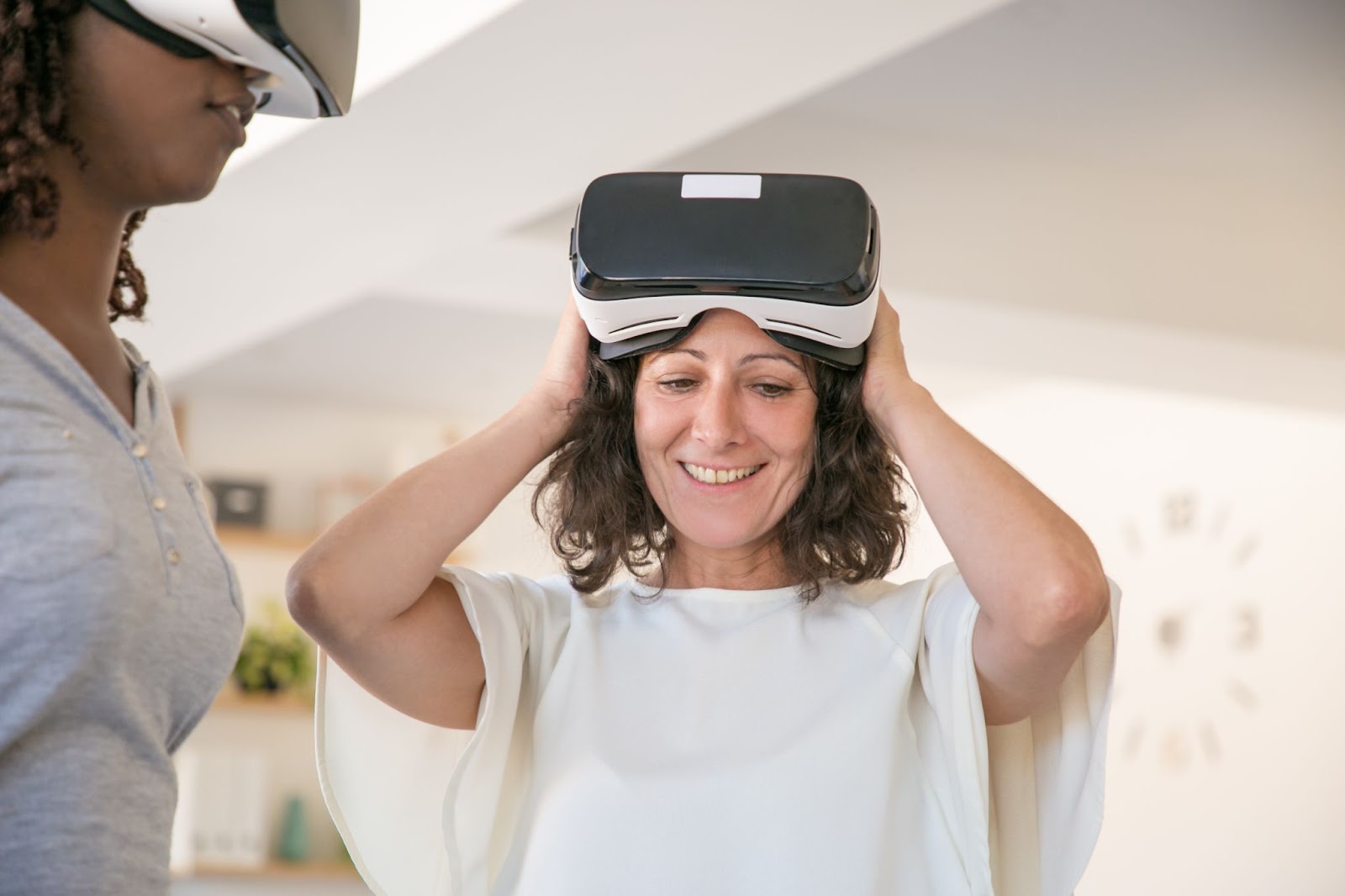 Woman adjusting her virtual reality headset
