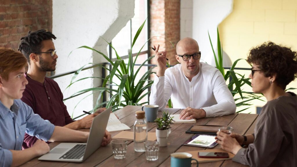 A group of employees discussing employee mental health issues