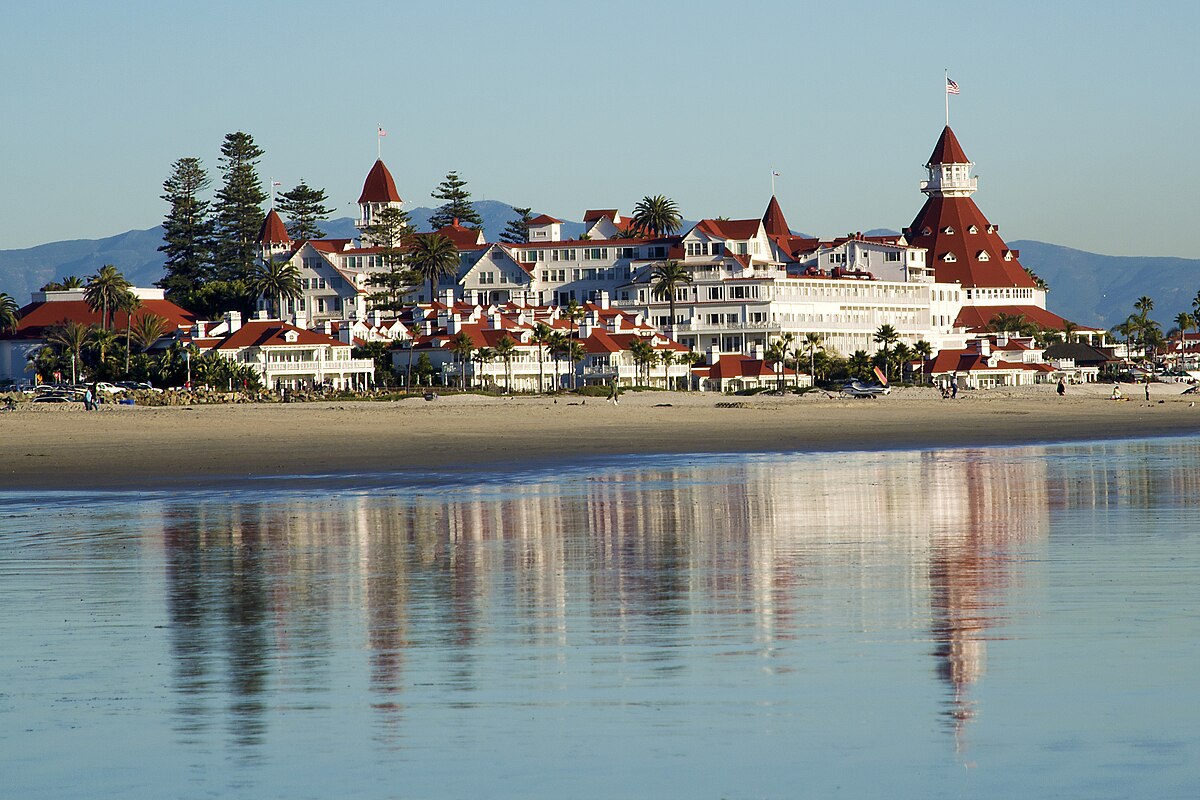 The most famous hotel on the shore with pine trees.