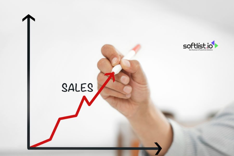 Hand drawing an upward sales graph on a transparent board