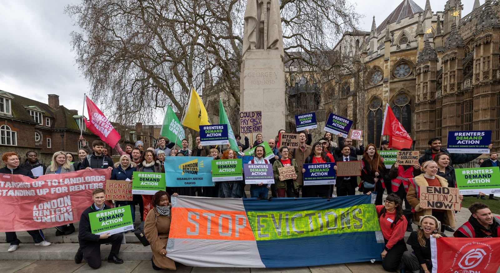 RRC members and supporters outside Parliament with placards and banners