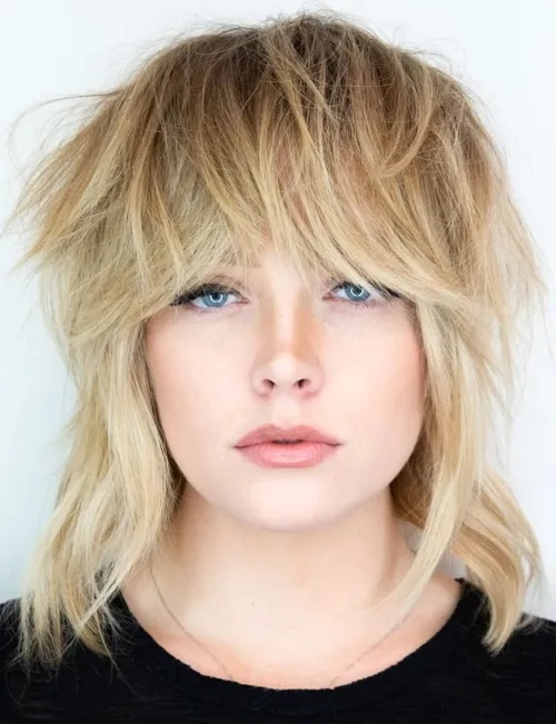 Picture of a lady wearing the Wolf Cut for Medium Length Hair