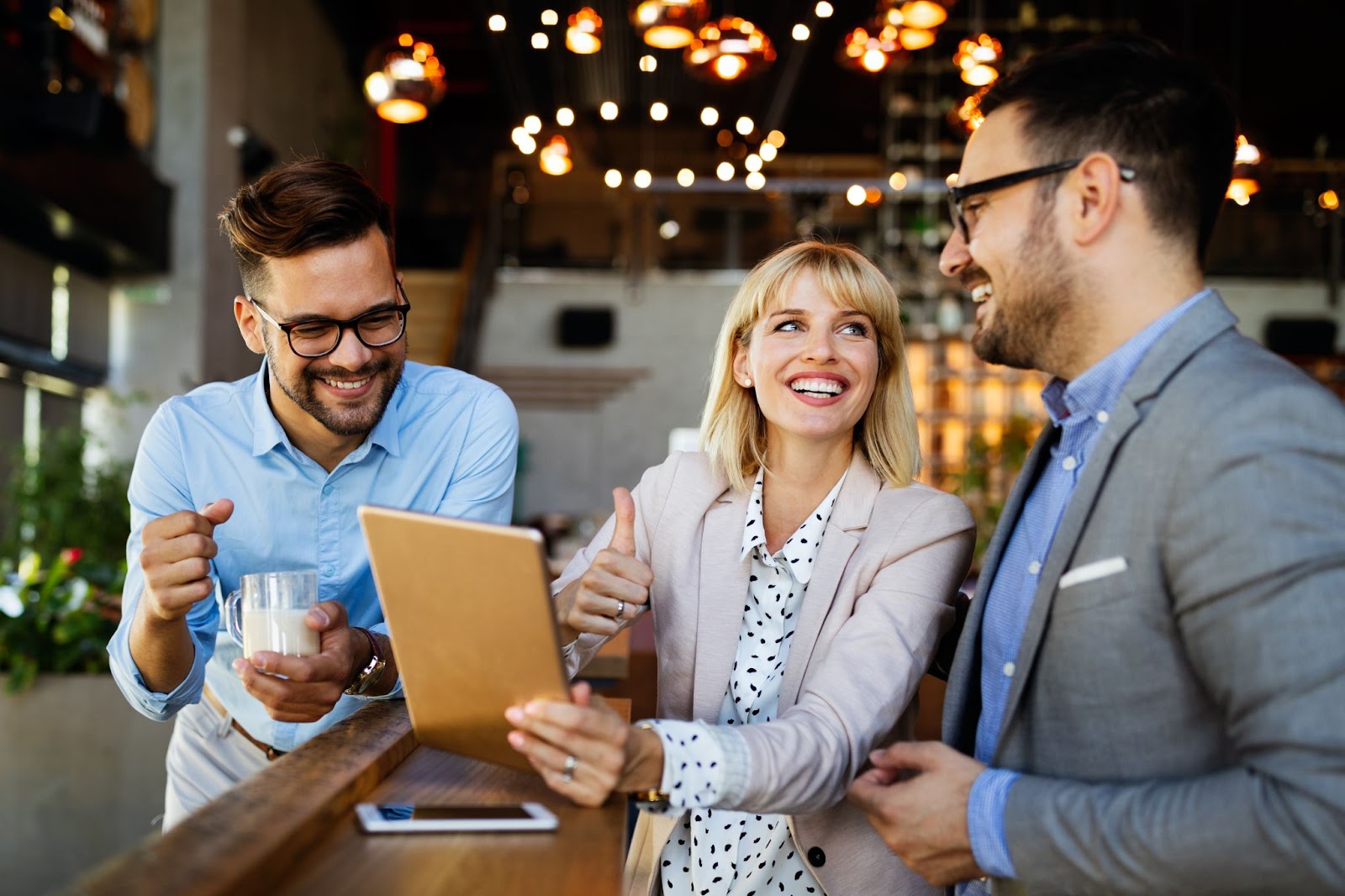  Happy employees discuss strategies in the office. 