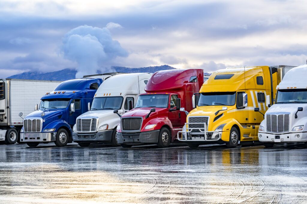 semi trucks lined up in a parking lot in washington dc, vehicle occupant remaining in the vehicle