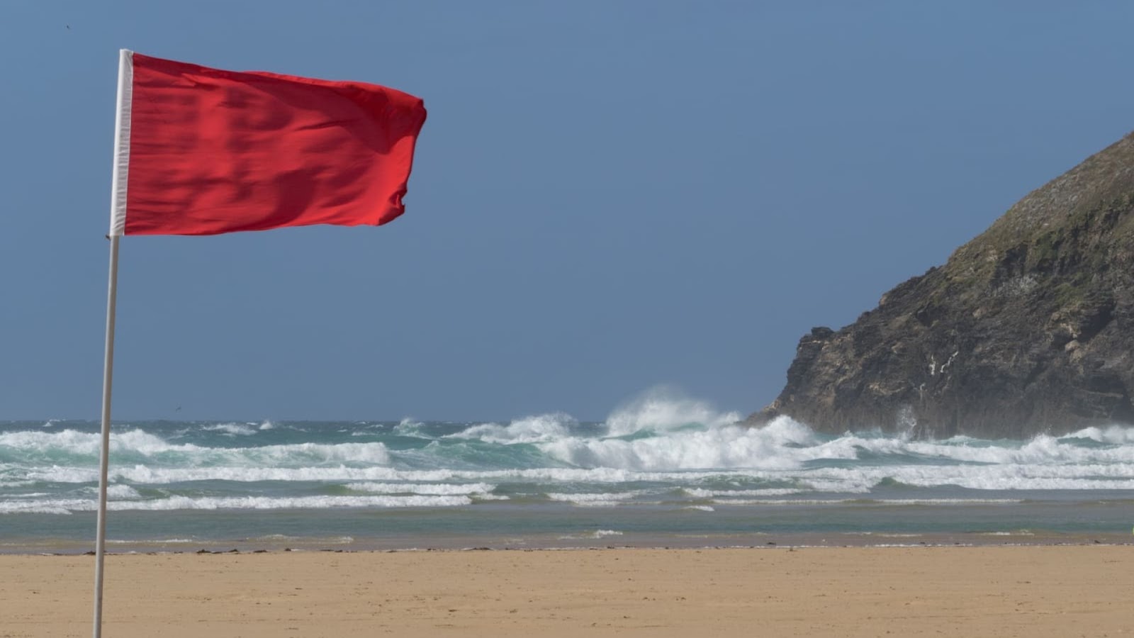 An image of a red safety beach flag